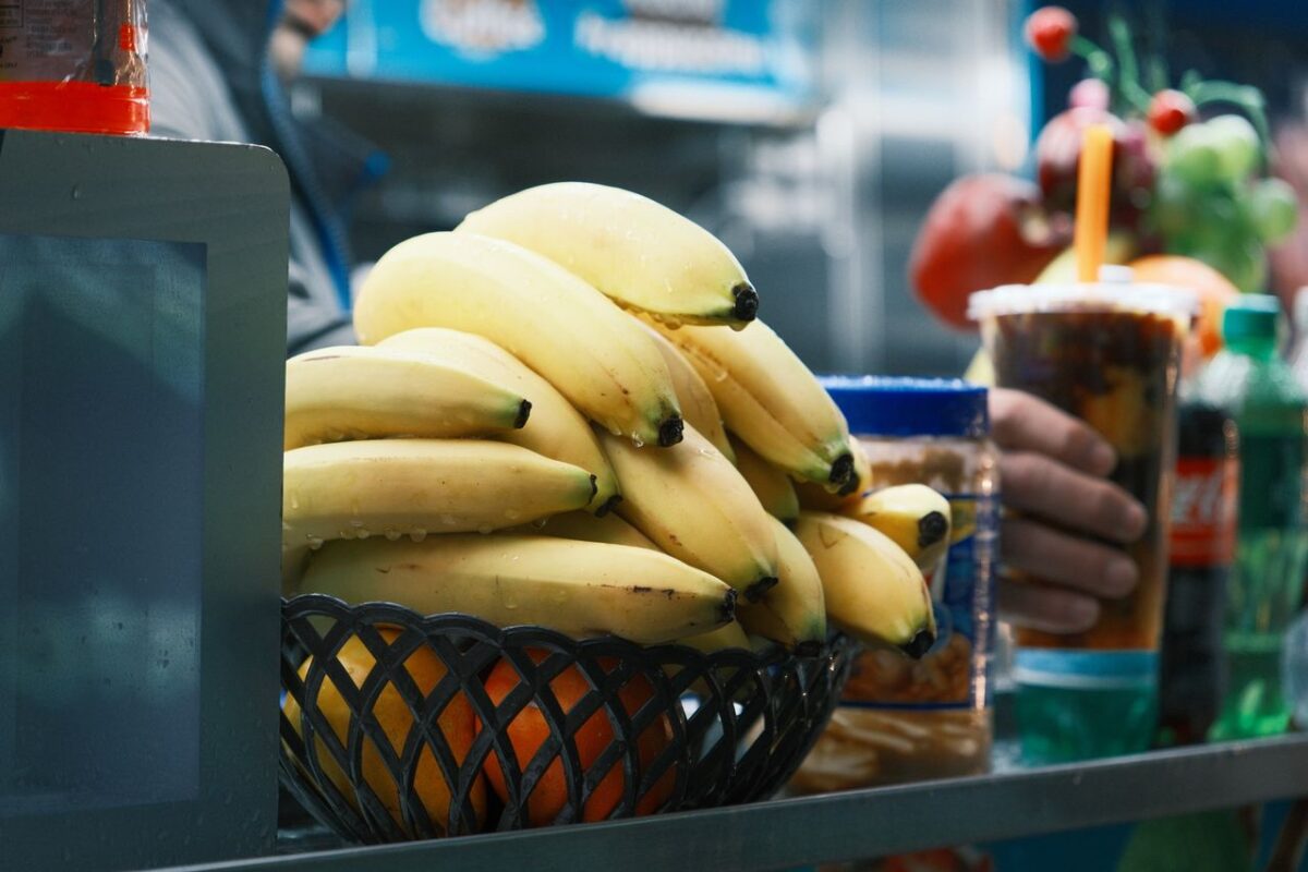 A vibrant display of bananas at a street vendor in New York City, capturing local food culture.